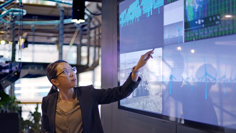 Woman pointing to the screen